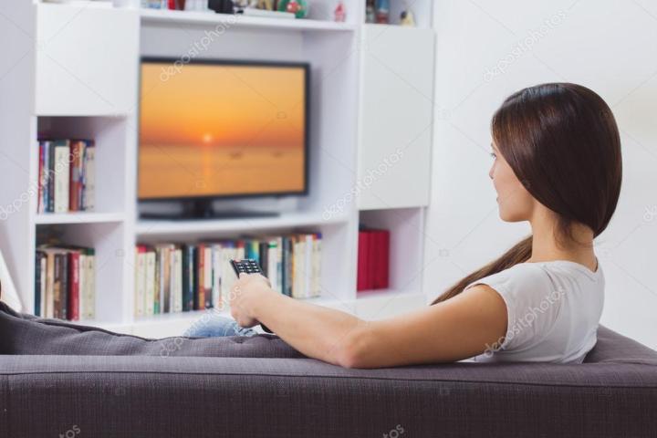 depositphotos_94421790-stock-photo-woman-watching-tv-at-home